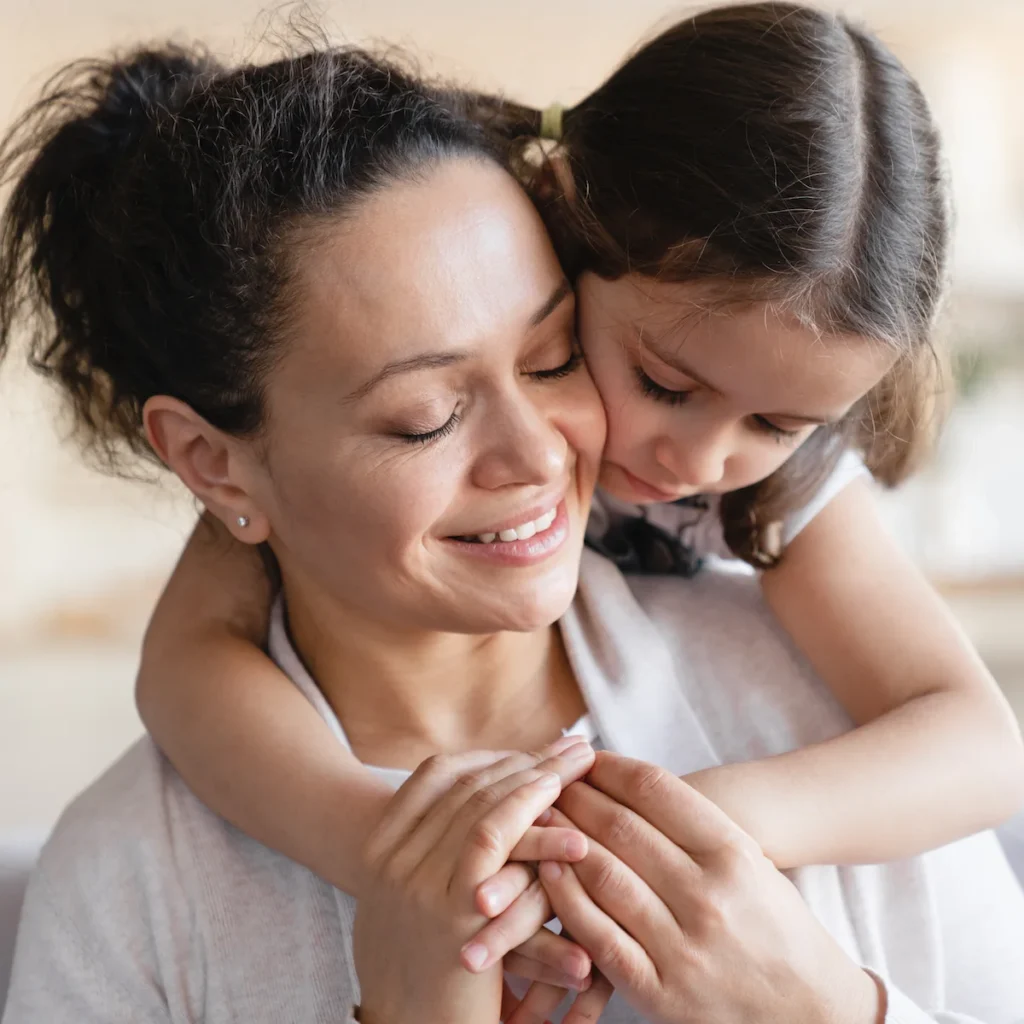 mother daughter hugging child custody attorney concept