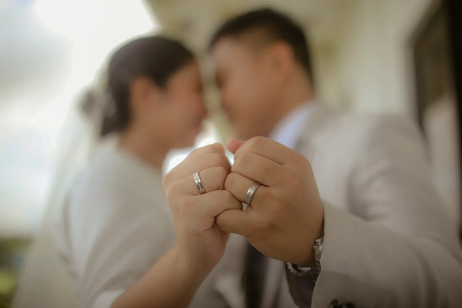prenup concept couple zoomed in on wedding rings
