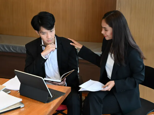 handicapped worker in a wheelchair working with lawyer