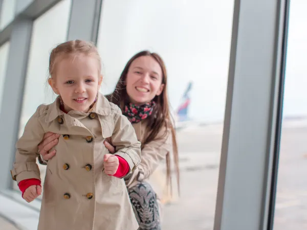 mother and little girl in airport child relocation divorce