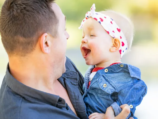 young caucasian father and baby girl at the park after custody battle